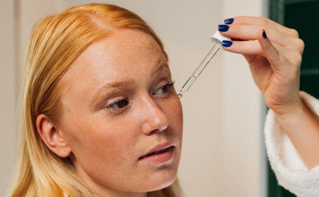 Woman applying succinic acid